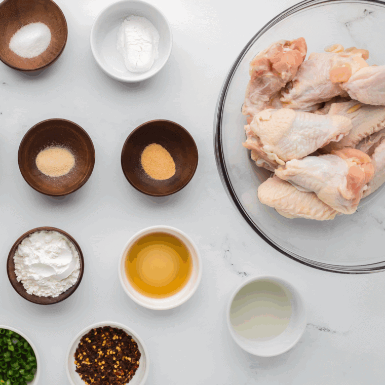 Ingredients needed for Air Fryer Chipotle-Lime Sticky Wings on kitchen table.