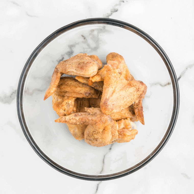 Chipotle sauce, lime juice, lime zest, water, salt, and pepper whisked together in a large mixing bowl.