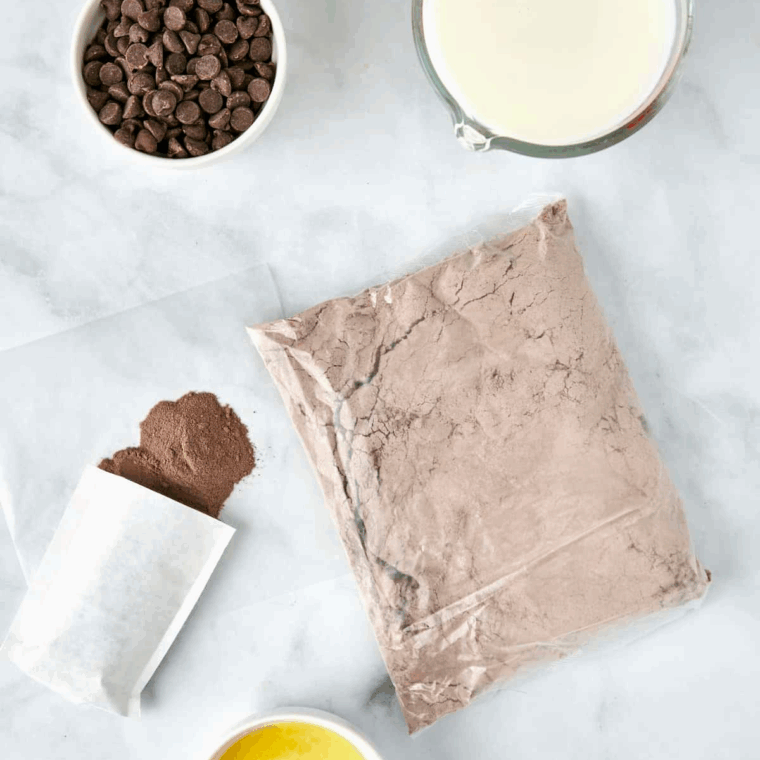 Ingredients needed for Air Fryer Chocolate Cake Mix Donuts on kitchen table.