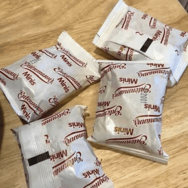 Unwrapping Entenmann's snack pies from their packaging