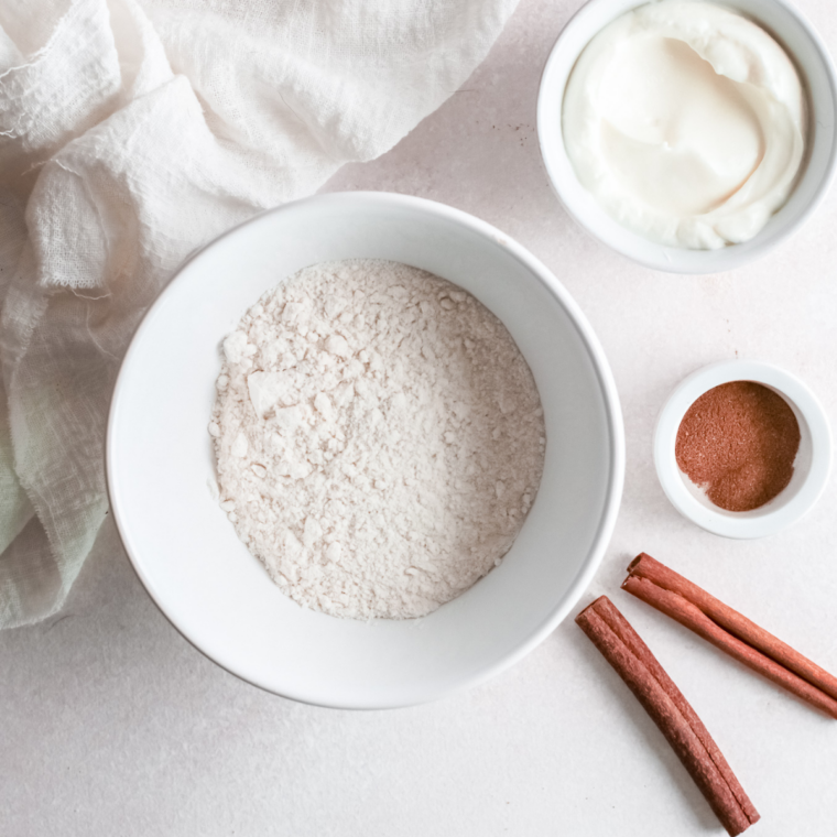 Ingredients needed for Air Fryer Funnel Cakes on kitchen table.