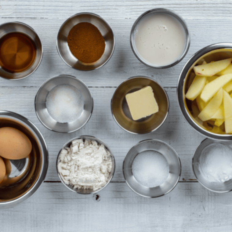 Ingredients needed for Air Fryer German Apple Pancakes on kitchen table.