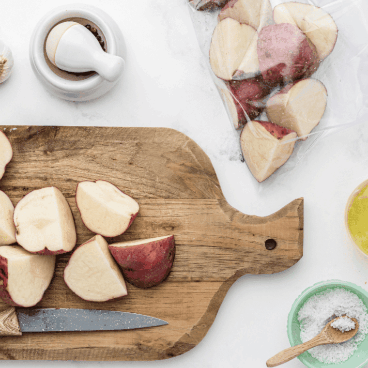 Sliced red and Russet potatoes, cut into 1/4-inch pieces, ready for cooking.