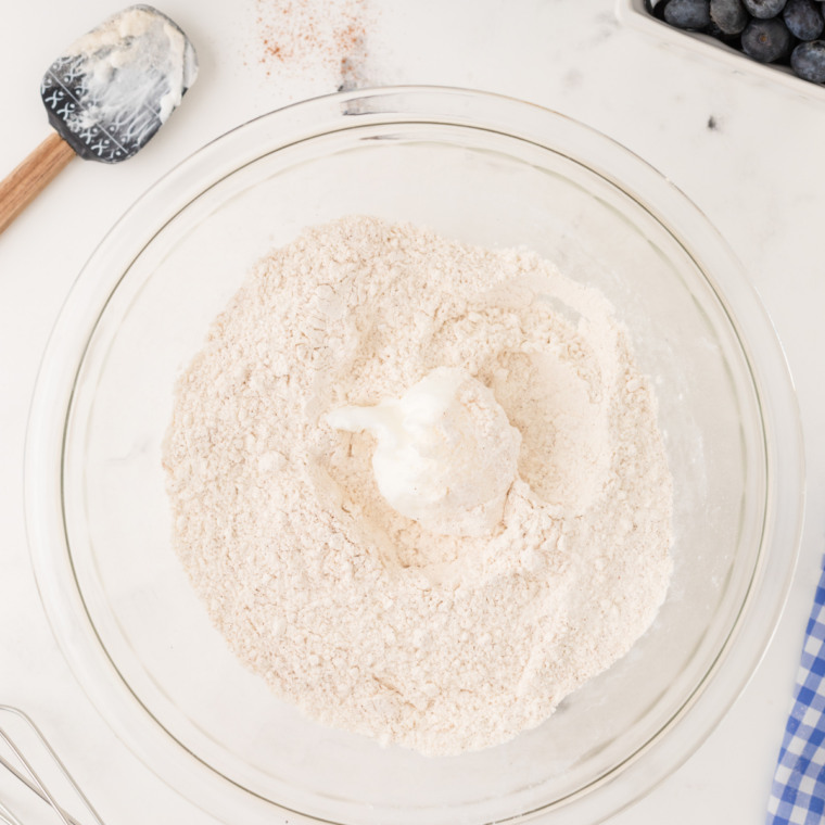 Butter and sugar creamed to a pale, fluffy texture in a glass mixing bowl