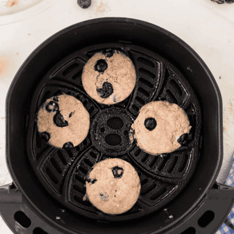 Place formed blueberry biscuits into the air fryer basket.