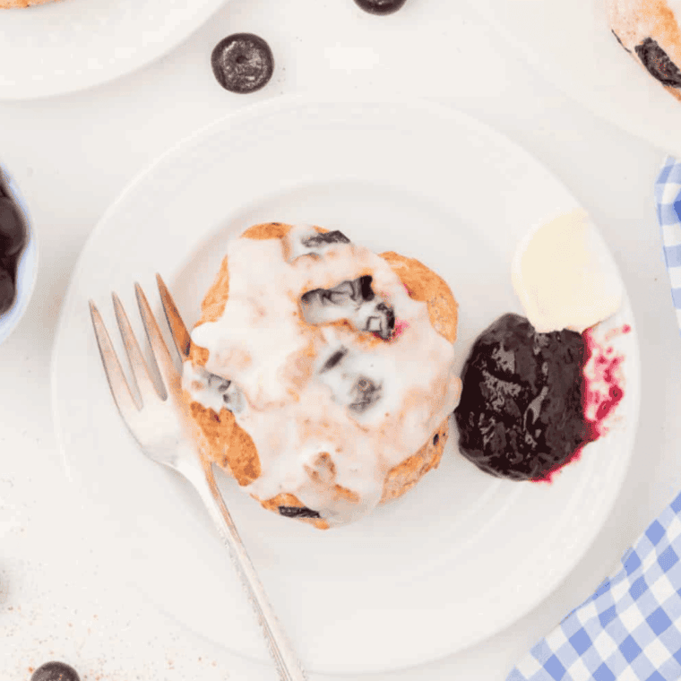 Golden-brown blueberry biscuits freshly cooked in an air fryer, ready to serve.