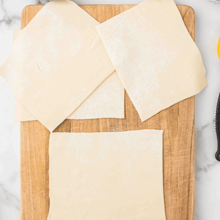 Ingredients needed for Easy Air Fryer Puff Pastry Beignets on kitchen table.