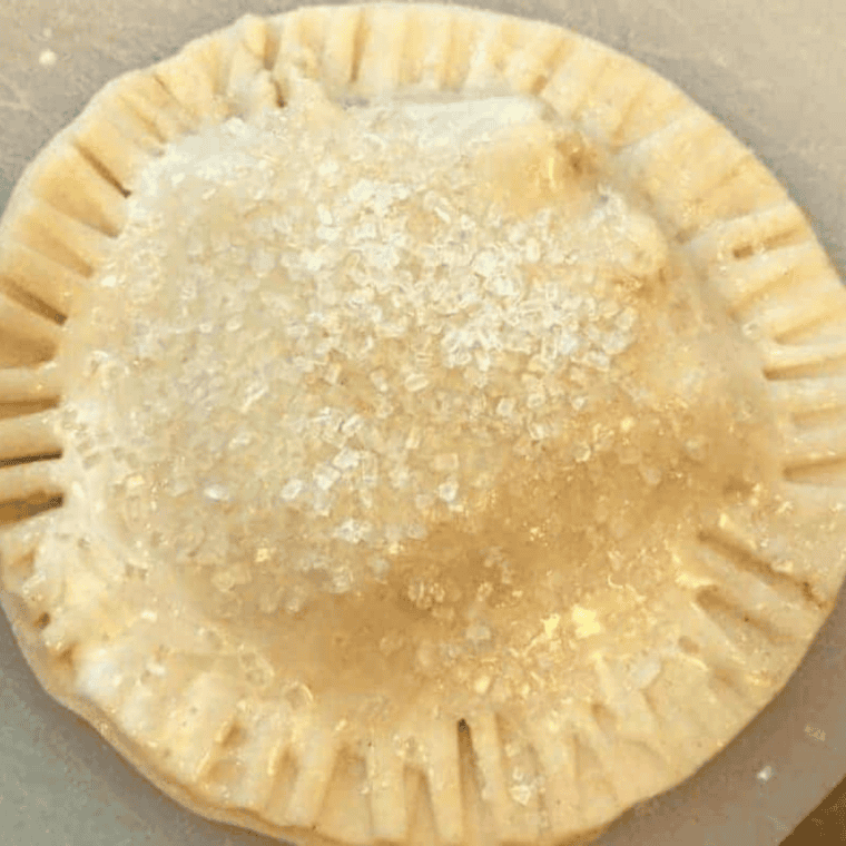 Air fryer apple hand pie with a crisp, golden sparkling-sugar crust