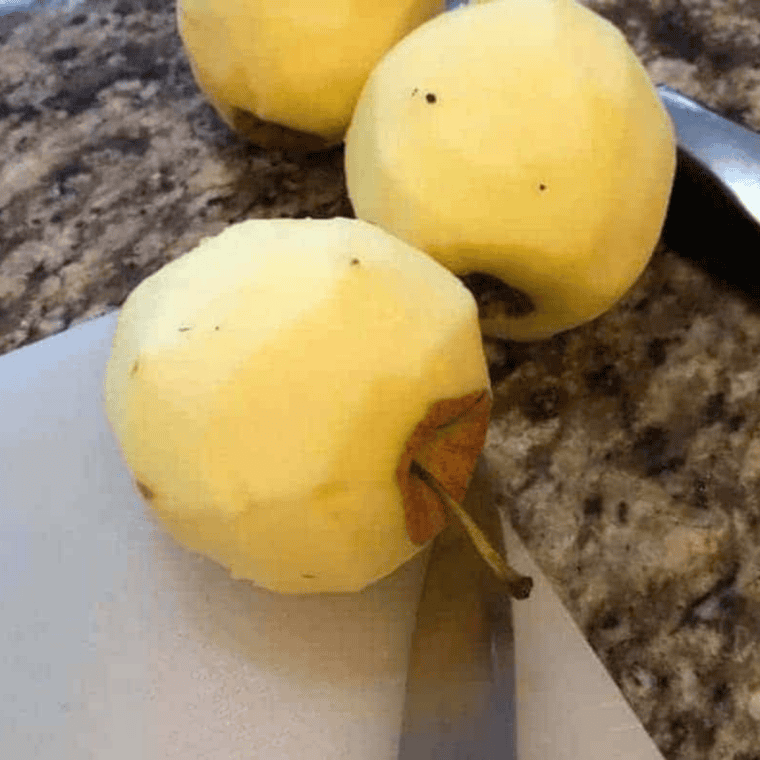 Peeling and dicing fresh apples for homemade apple hand pie filling