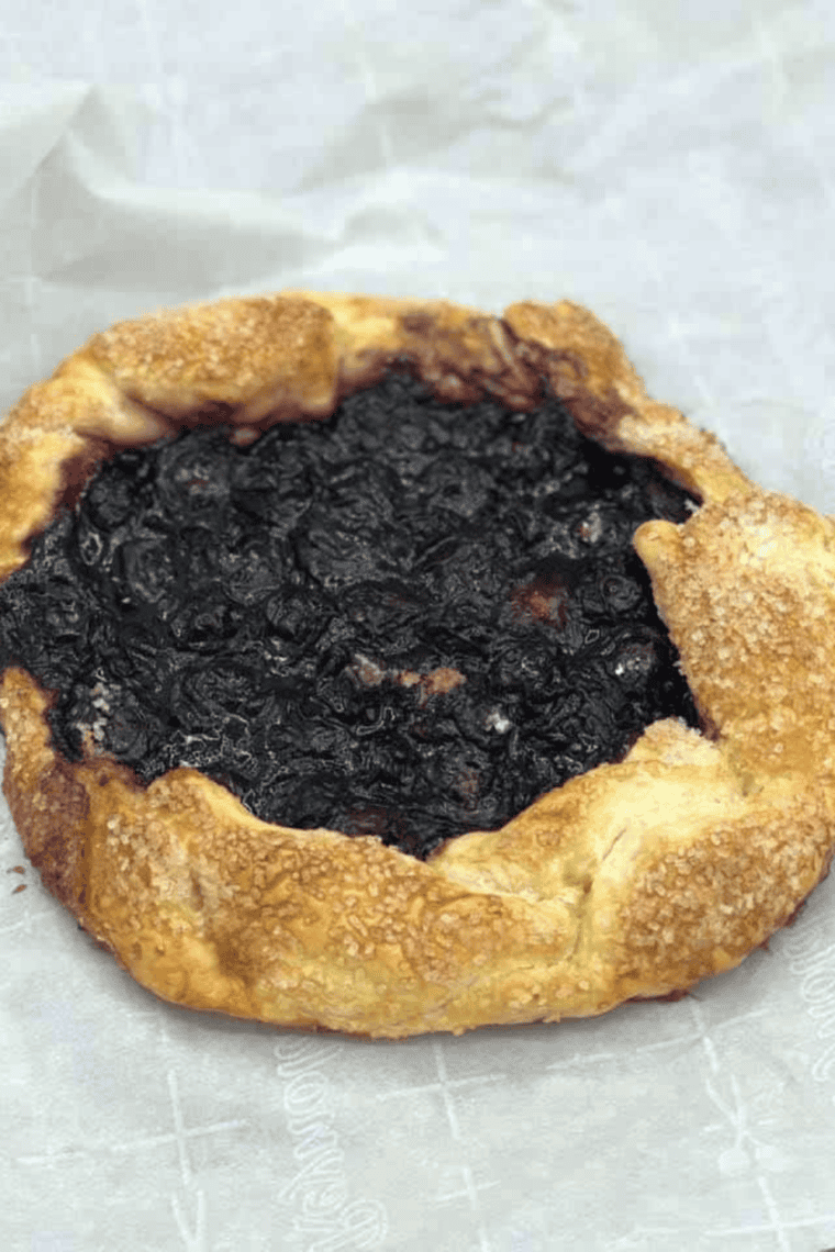 Golden air fryer blueberry galette with flaky pastry and juicy blueberry center