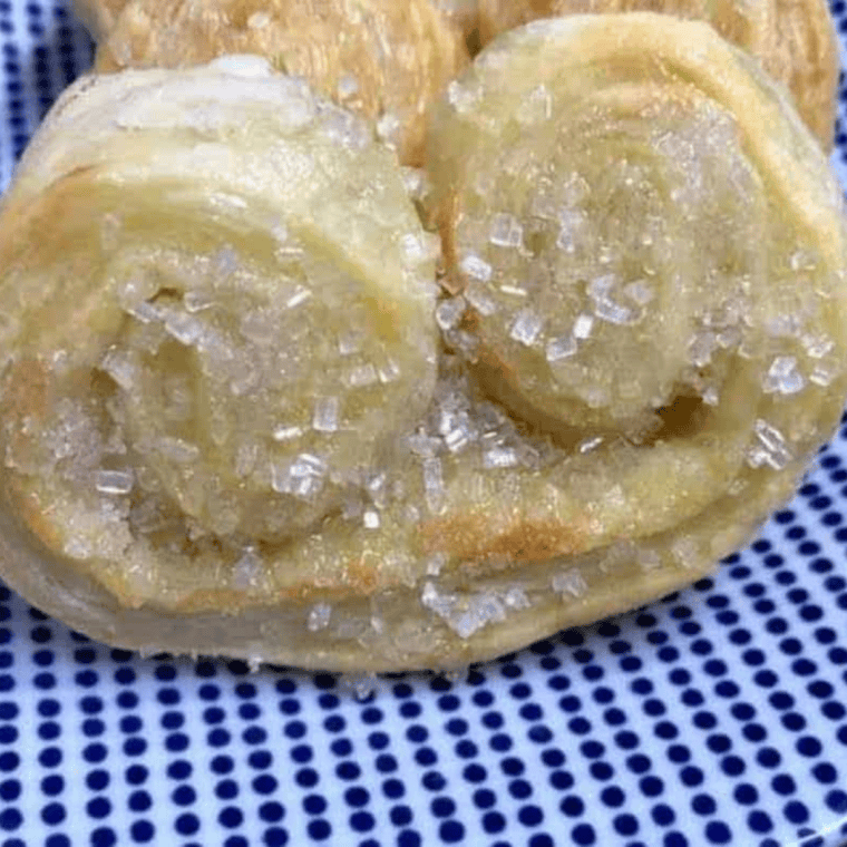 Close of up Air Fryer French Palmier on blue and white plate.