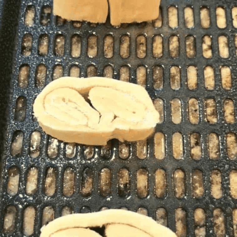 Semi-frozen puff pastry dough cut into 1-inch pieces, ready for air frying.