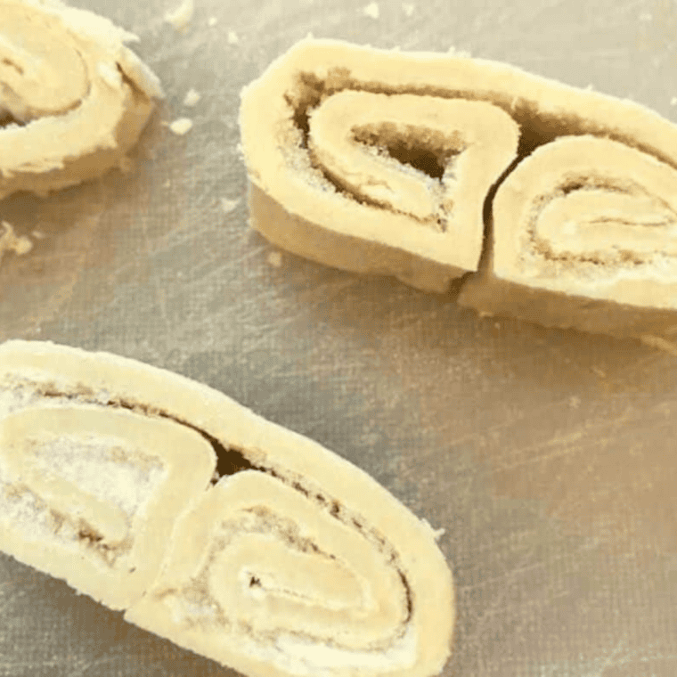 Puff pastry rolled from both ends to meet in the middle, seam pressed, chilling in freezer.