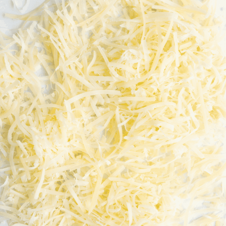 Ingredients needed for Easy Air Fryer Parmesan Crisps on kitchen table.