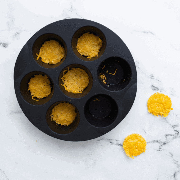 Place muffin pan in air fryer basket, cook at 400°F for 4–5 minutes.