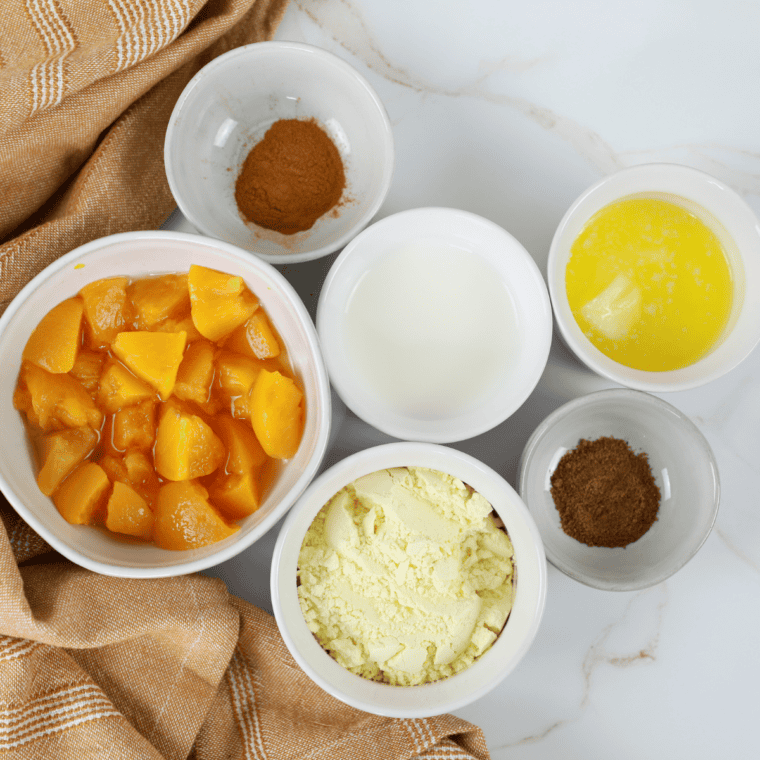 Ingredients needed for Easy Air Fryer Muffin Tin Peach Pies on kitchen table.