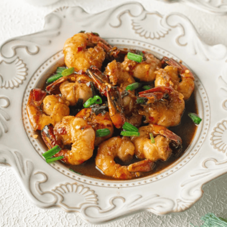Glossy air fryer honey garlic shrimp served over steamed white rice