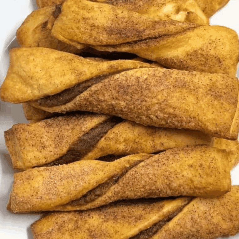 golden-brown apple pie Danish twists filled with cinnamon-spiced apples and sprinkled with cinnamon sugar