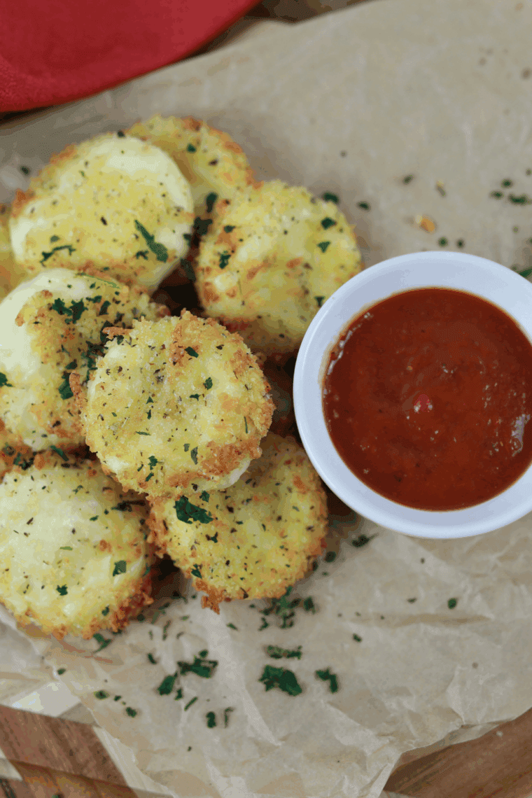 Air Fryer Babybel Cheese bites, golden brown and melted, served on a plate.