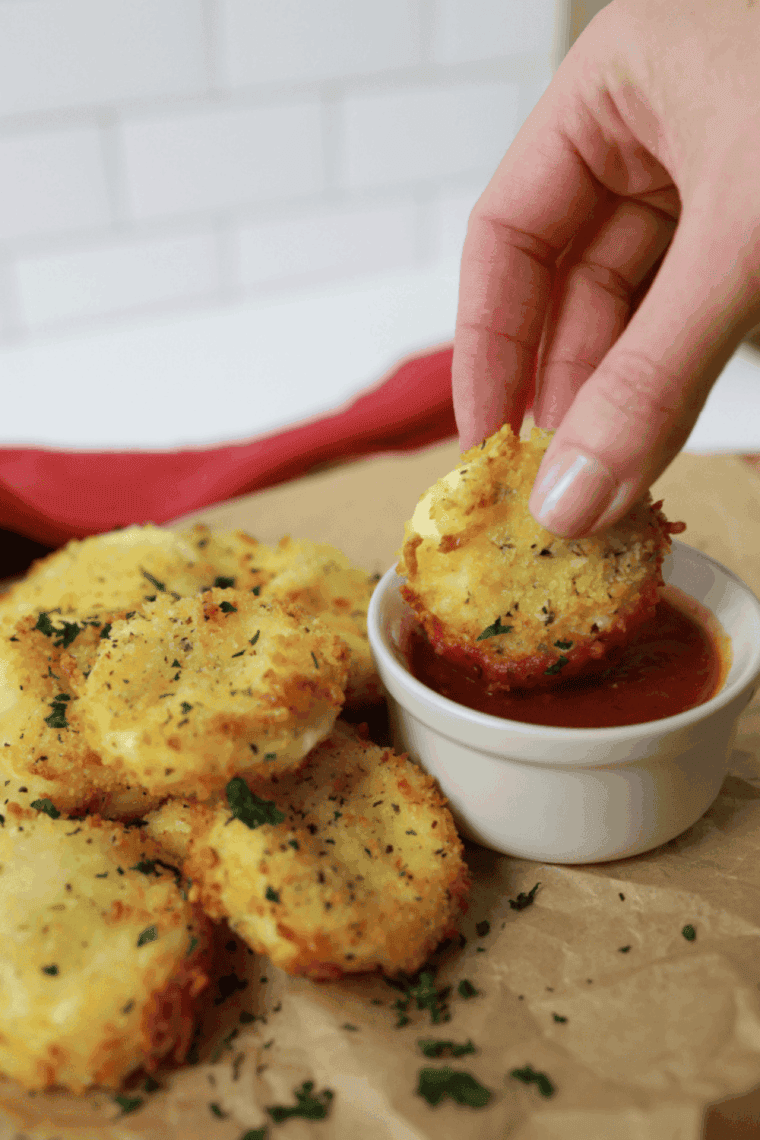 “Golden, melted Air Fryer Babybel Cheese bites on a serving plate, crispy outside and gooey inside.”
