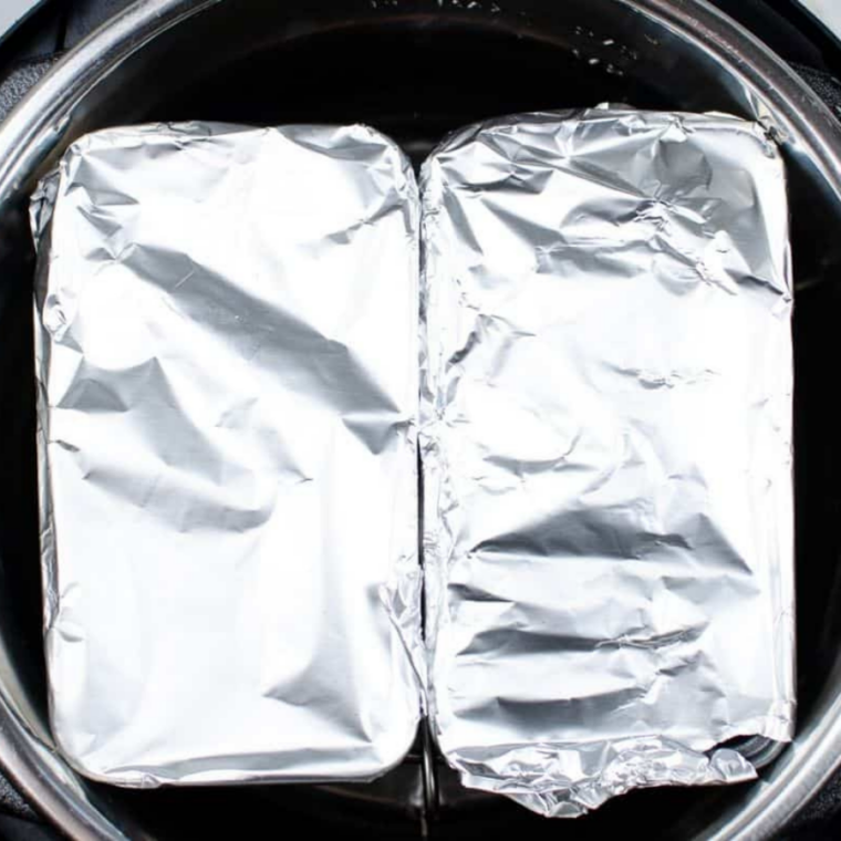 Pressure Cook): Filled pan placed on trivet inside Instant Pot with water, then cooked under high pressure until set.