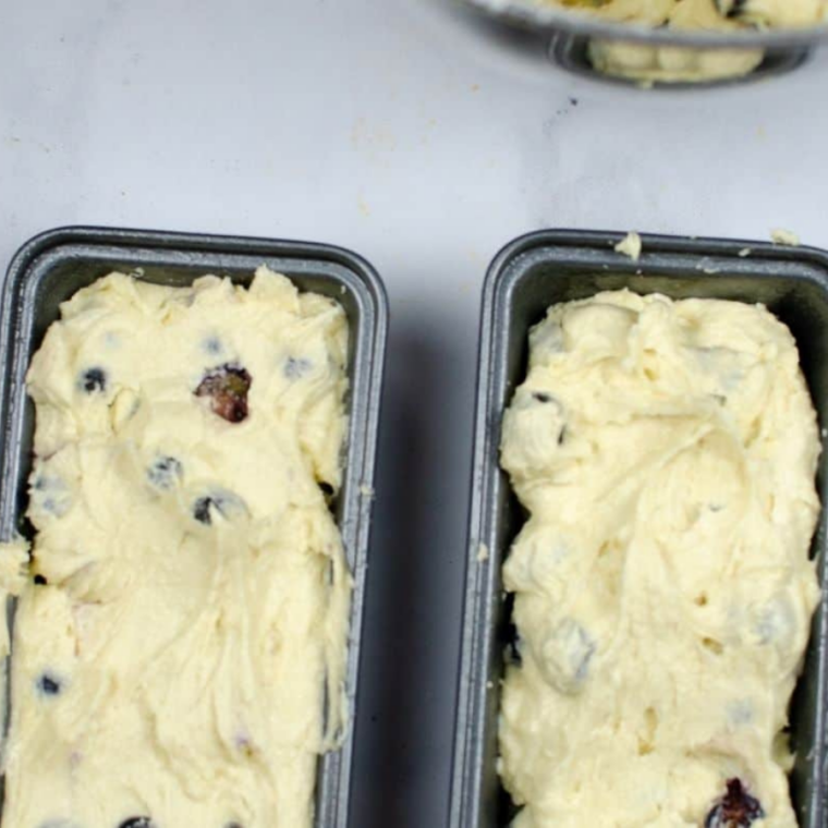 (Prepare the Pan): Greased pan filled with batter, smoothed on top, and loosely covered with foil leaving space for steam.