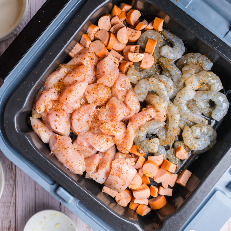Cajun seasoned shrimp searing in a skillet until pink
