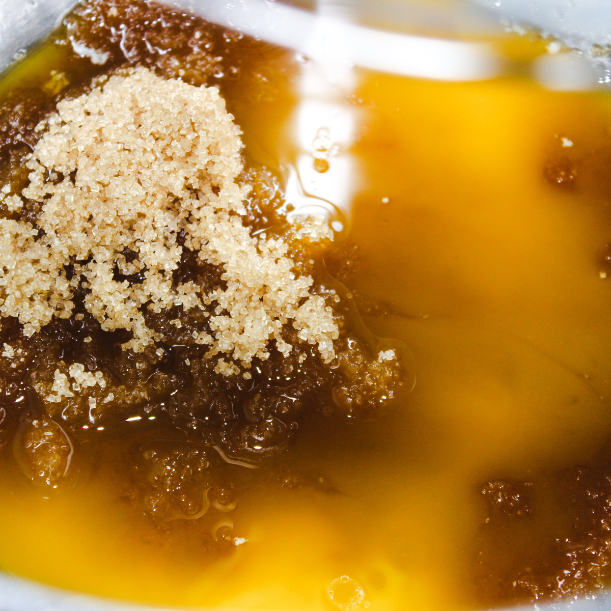 Melted butter and brown sugar beaten smooth in a mixing bowl with an electric mixer