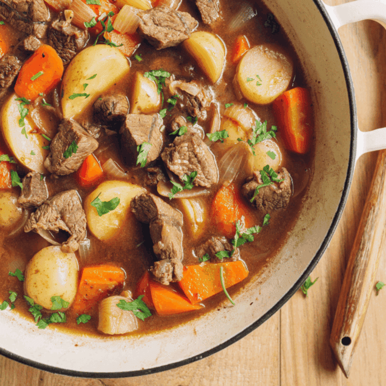 Bowl of Easy Copycat Jason’s Deli Beef Stew with tender beef, carrots, potatoes, and savory herbs in a rich broth.