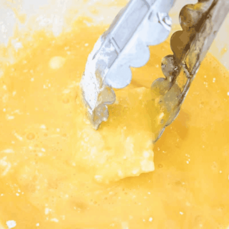 Dip in the egg wash.