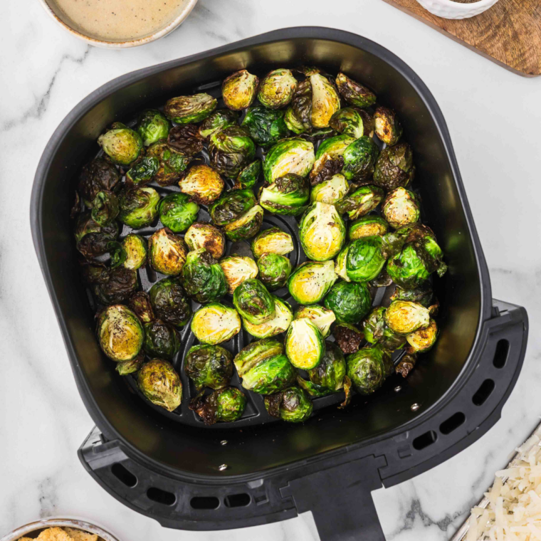 copycat Lazy Dog restaurant Brussels sprouts tossed in lemon garlic butter and topped with croutons and Romano
