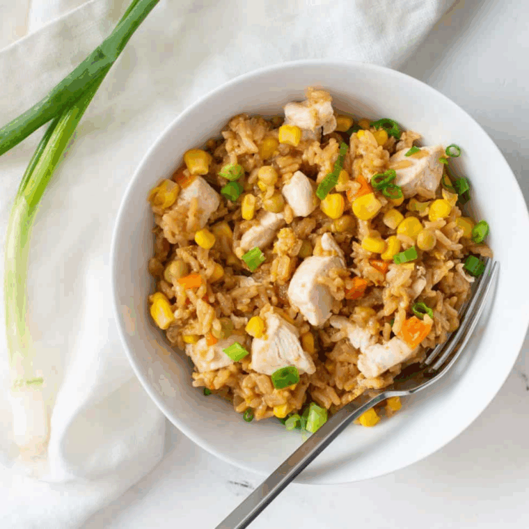 Copycat PF Chang’s Chicken Fried Rice with diced chicken and crisp vegetables