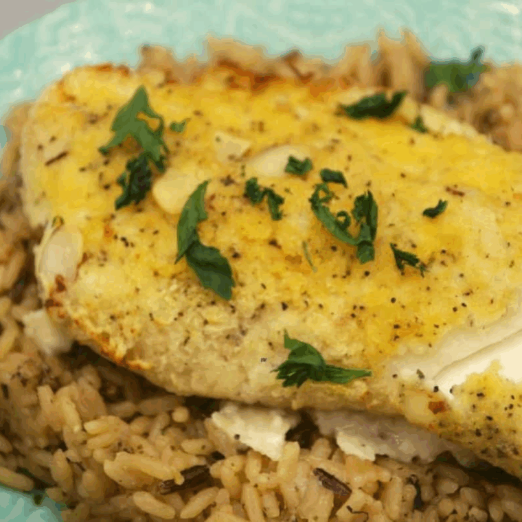 Breaded cod fillets arranged in air fryer basket, ready to cook at 350&deg;F