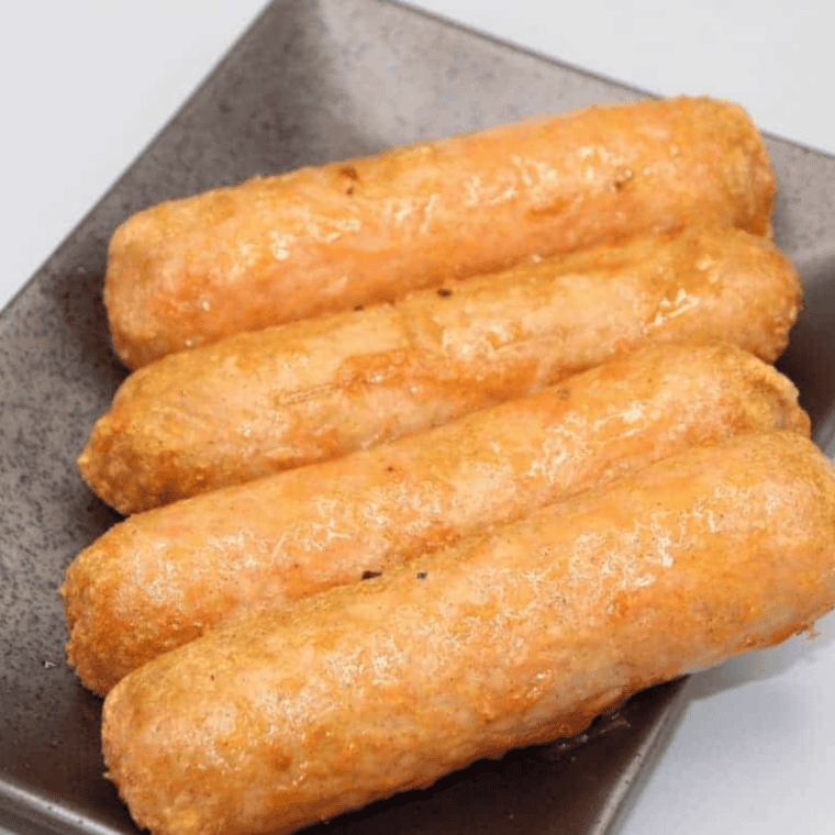 Serving cooked Beyond Sausage in buns with toppings or as-is.