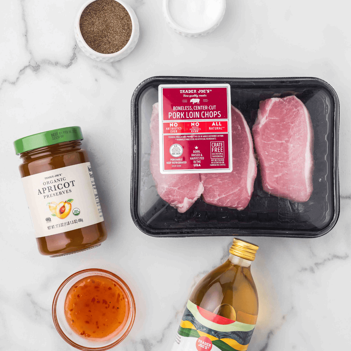 Ingredients for air fryer frozen pork chops laid out on a counter