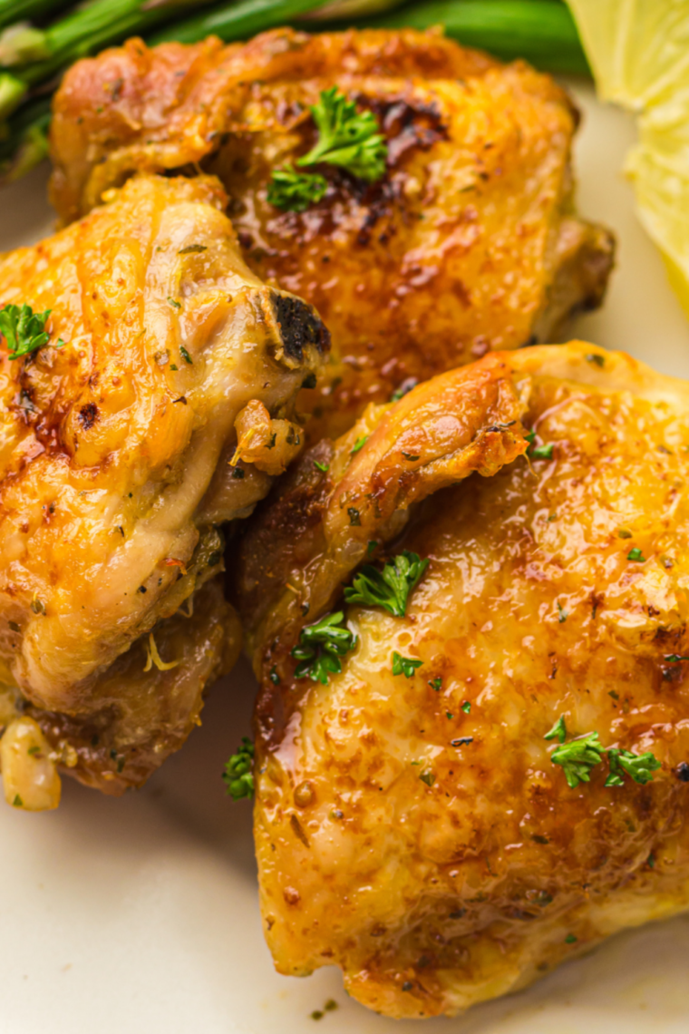 Sliced air fryer turkey thigh showing juicy dark meat on a cutting board
