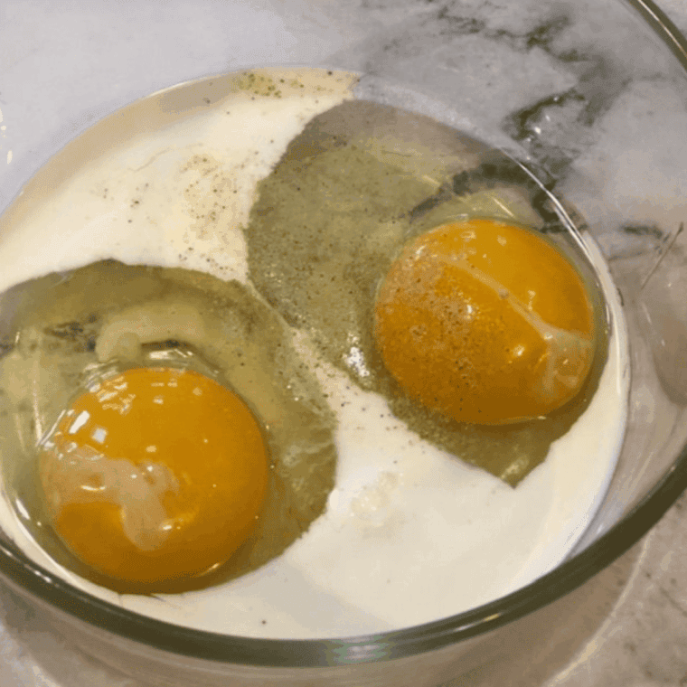 Whisk eggs with cream, salt, and pepper in a bowl.