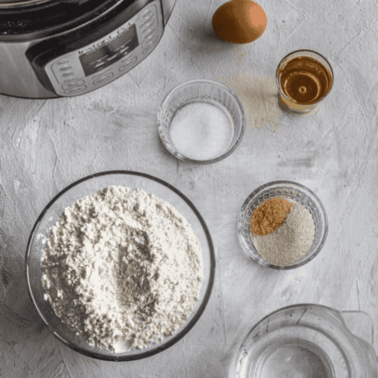 Ingredients needed for Easy Instant Pot Dinner Rolls on kitchen table.