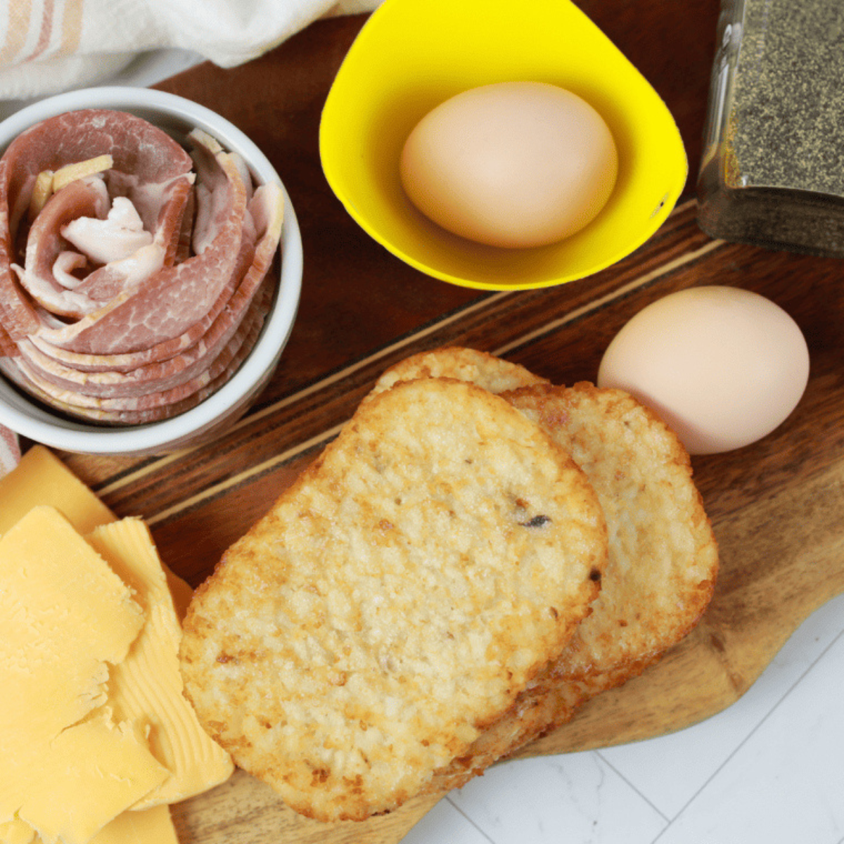 Ingredients needed for Frozen Hash Browns in Air Fryer (Crispy in 10 Minutes &mdash; Any Brand!) on kitchen table.