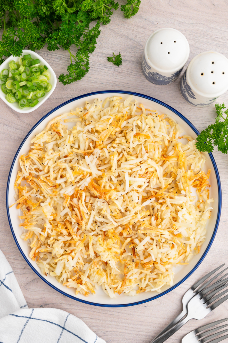Air fryer shredded hash browns cooked until evenly crisp and golden with fluffy interior for quick diner-style breakfast side
