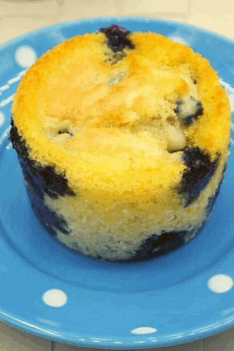 Freshly baked air fryer blueberry pancake muffins, golden and topped with juicy blueberries