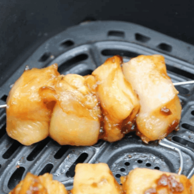 Preheat air fryer, place yakitori skewers in basket without overlapping, cook 10&ndash;12 minutes, turning halfway, optional higher heat for char.