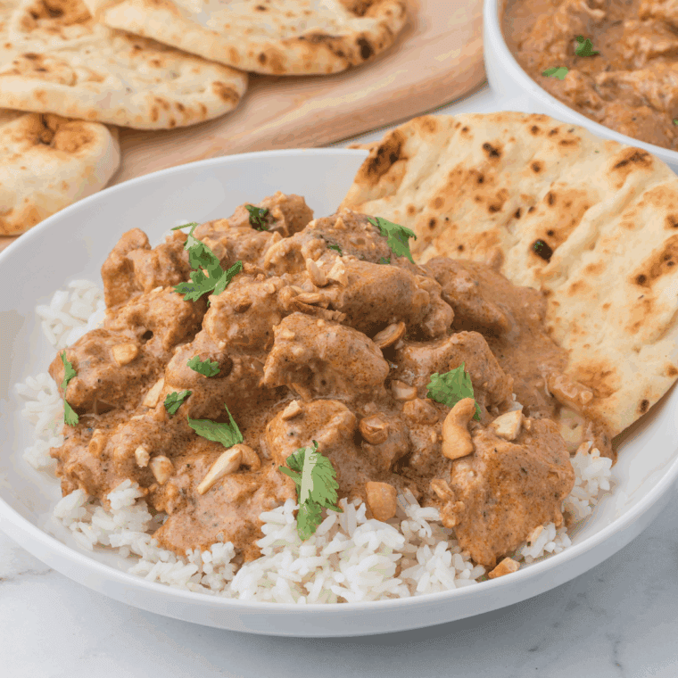 Air fryer chicken yakitori skewers cooking in basket, golden brown and glazed with soy-ginger sauce.