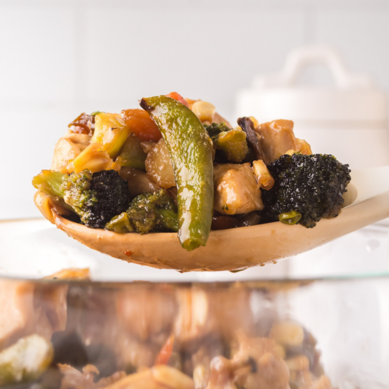 Close-up of glossy teriyaki chicken bites and crispy broccoli florets from the air fryer