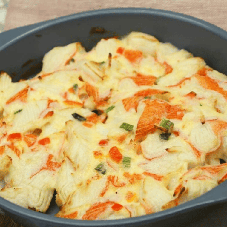 Air fryer crab casserole cooking, before shredded cheese is added.