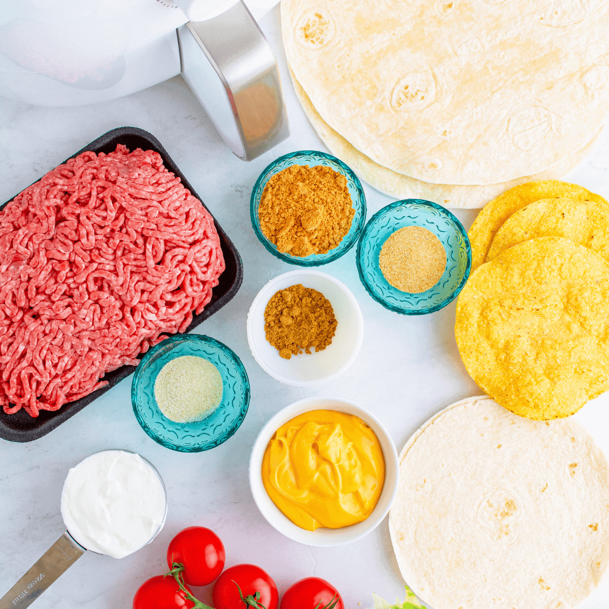Ingredients needed for Air Fryer Copycat Taco Bell Crunchwrap Supreme on kitchen table.