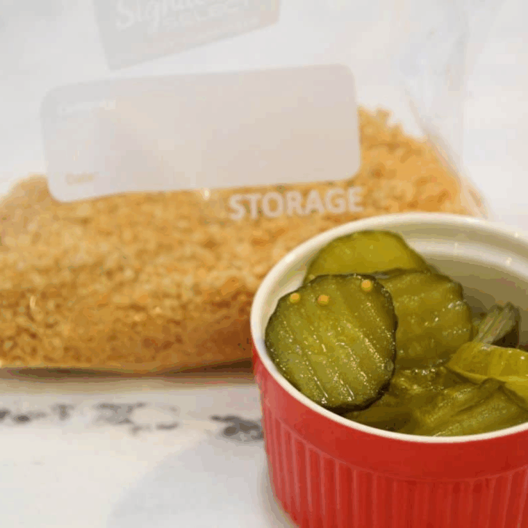 Ingredients needed for Air Fryer Shake and Bake Fried Pickles on kitchen table.