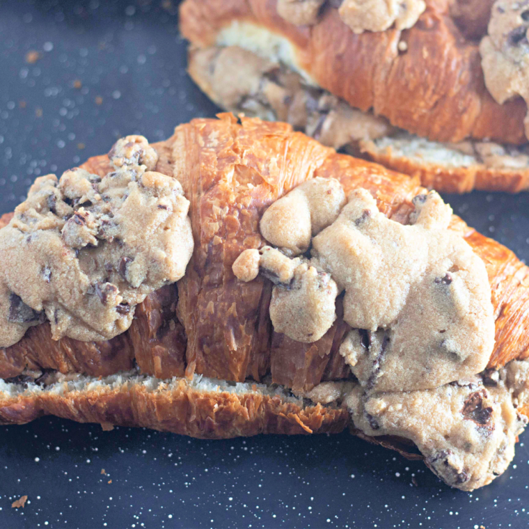 Chocolate chip cookie croissants baked golden brown on a parchment-lined baking sheet