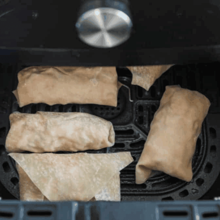 Place Buffalo Chicken Egg Rolls in the air fryer basket.
