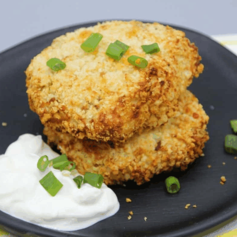 Golden-brown air fryer potato pancakes, crispy outside and soft inside, served on a plate.